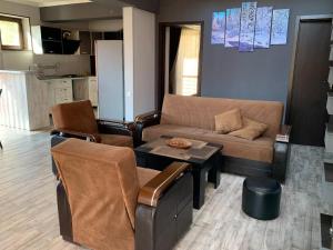 Posezení v ubytování Villa Astoria Bakuriani
