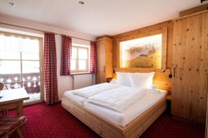 Кровать или кровати в номере Alpenpension Ettlerlehen