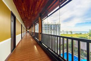 a balcony with a view of the ocean at Qualia Resort Phu Quoc in Phú Quốc