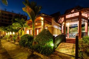 a house with a pathway leading to it at night at Qualia Resort Phu Quoc in Phú Quốc