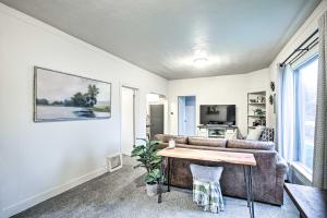 a living room with a couch and a table at High-End and Homey Family Abode Walk Downtown! in Coeur d'Alene