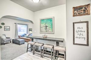 a living room with a bar with stools at High-End and Homey Family Abode Walk Downtown! in Coeur d'Alene