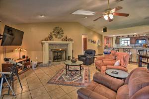 a living room with a couch and a fireplace at Pirate Cove Home in Welaka Dock and River Access! in Welaka