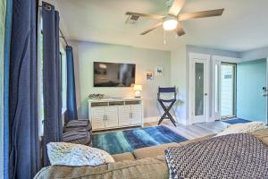 a living room with a couch and a ceiling fan at Hilton Head Tropical Condo Walk to Coligny Beach! in Hilton Head Island