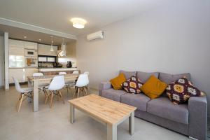 a living room with a couch and a table at Fruta in La Mata