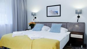 Łóżko lub łóżka w pokoju w obiekcie Hotel Rezydencja AS & Spa-Najwyżej w Karpaczu