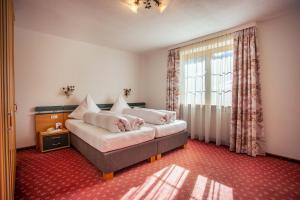 a living room with a couch and a window at Pension Inge in Sankt Anton am Arlberg