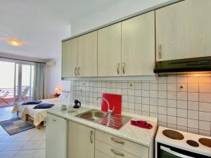 A kitchen or kitchenette at SeaFront Villa Ourania