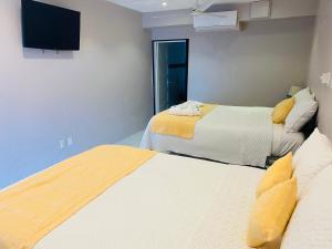 Voodi või voodid majutusasutuse La Isla Resort toas