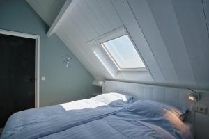 Postel nebo postele na pokoji v ubytování Vakantiehuis Babelweg 5 - Baddomburg