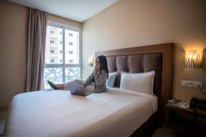 Uma cama ou camas num quarto em Hotel Etoile Du Nord
