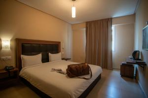 Uma cama ou camas num quarto em Hotel Etoile Du Nord