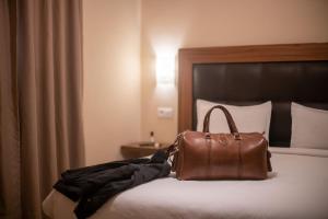 Uma cama ou camas num quarto em Hotel Etoile Du Nord