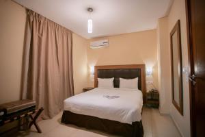 Uma cama ou camas num quarto em Hotel Etoile Du Nord