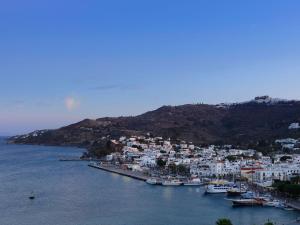 a group of boats are docked in a harbor at Patmos Eye Traditional Luxury Villas in Skala