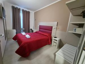 A bed or beds in a room at Hotel City 20
