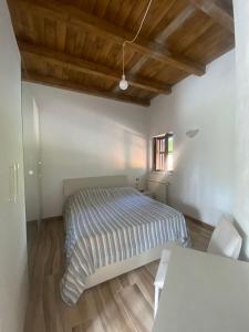 Letto o letti in una camera di BORGO DON ARMANDO - Appartamento A B C E