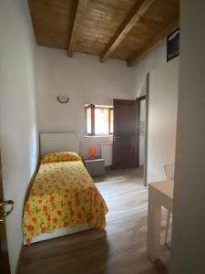 Letto o letti in una camera di BORGO DON ARMANDO - Appartamento A B C E