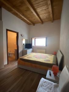 Letto o letti in una camera di BORGO DON ARMANDO - Appartamento A B C E