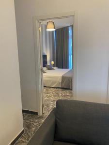 Postel nebo postele na pokoji v ubytování Apartamentos La Aldea Suites