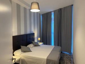 Postel nebo postele na pokoji v ubytování Apartamentos La Aldea Suites