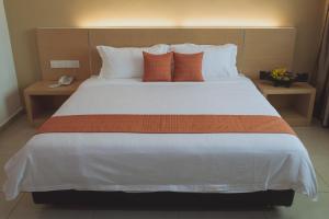 Voodi või voodid majutusasutuse Paragon Lutong Hotel toas