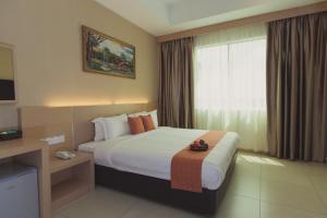 Voodi või voodid majutusasutuse Paragon Lutong Hotel toas
