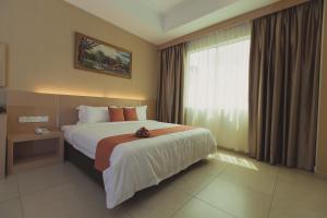 Voodi või voodid majutusasutuse Paragon Lutong Hotel toas