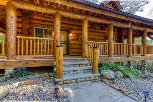 a log cabin with stairs leading to the front door at Sonshine By The Stream, Next To A Stream, 560 FREE tickets each paid day in Cosby