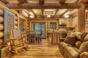 a kitchen and living room with a couch and a table at Sonshine By The Stream, Next To A Stream, 560 FREE tickets each paid day in Cosby