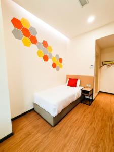 Postel nebo postele na pokoji v ubytování Qlio Hotel