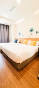 Postel nebo postele na pokoji v ubytování Qlio Hotel