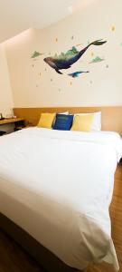 Postel nebo postele na pokoji v ubytování Qlio Hotel