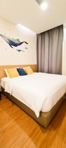 Postel nebo postele na pokoji v ubytování Qlio Hotel