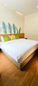 Postel nebo postele na pokoji v ubytování Qlio Hotel