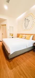 Postel nebo postele na pokoji v ubytování Qlio Hotel
