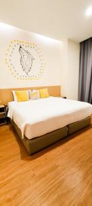 Postel nebo postele na pokoji v ubytování Qlio Hotel