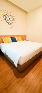 Postel nebo postele na pokoji v ubytování Qlio Hotel