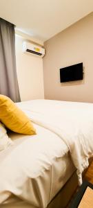 Postel nebo postele na pokoji v ubytování Qlio Hotel