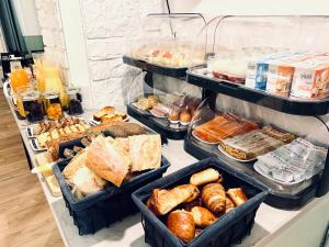 a refrigerator filled with lots of different types of food at Hôtel Gaspard in Le Touquet-Paris-Plage +26 photos