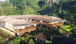 an aerial view of a house in the forest at Ijen Miner Family Homestay in Banyuwangi