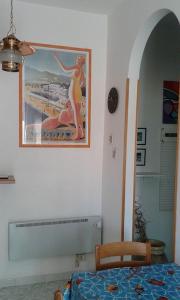 a bedroom with a picture of a woman on the wall at La Terrazza sul Mare in Levanto