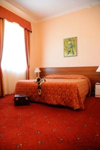 Postel nebo postele na pokoji v ubytování Hotel Ristorante Taverna Verde