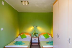 Postel nebo postele na pokoji v ubytování Rooms Edna