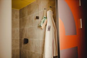 a bathroom with a shower with a white towel at CAB20 in Hamburg