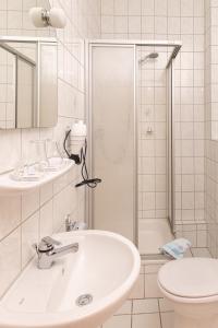 Koupelna v ubytování Hotel Carola