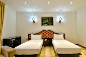 Cama o camas de una habitación en Royal Kandyan Hotel