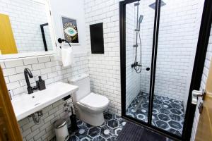 a bathroom with a toilet and a sink and a shower at Flats Company Ajda Apartment in Istanbul