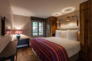 Letto o letti in una camera di La Cordée des Alpes SUP