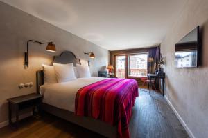 Letto o letti in una camera di La Cordée des Alpes SUP